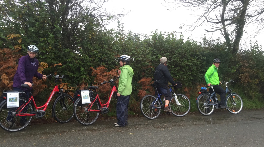 four bicyclists on a Devon country lane